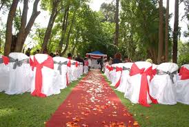 Wedding ceremony aisle decorated in red and white